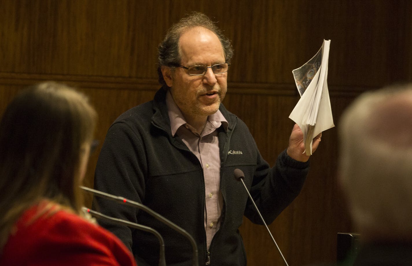 Tom Goldstein, who lives near the purposed stadium, held up a packet of papers and asked the council members if they had even read the 400 page document recently released about the stadium as he spoke in opposition of the stadium during the St. Paul City Council meeting on Wednesday, March 2, 2016, in St. Paul, Minn. ] RENEE JONES SCHNEIDER &#x2022; reneejones@startribune.com * he said it is 400 pages but I haven't seen for myself.