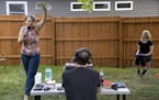 Actors Laura Stearns and Kim Kivens along with stage manager Samson Perry (middle) rehearsed a play in a south Minneapolis backyard. The a two-woman s