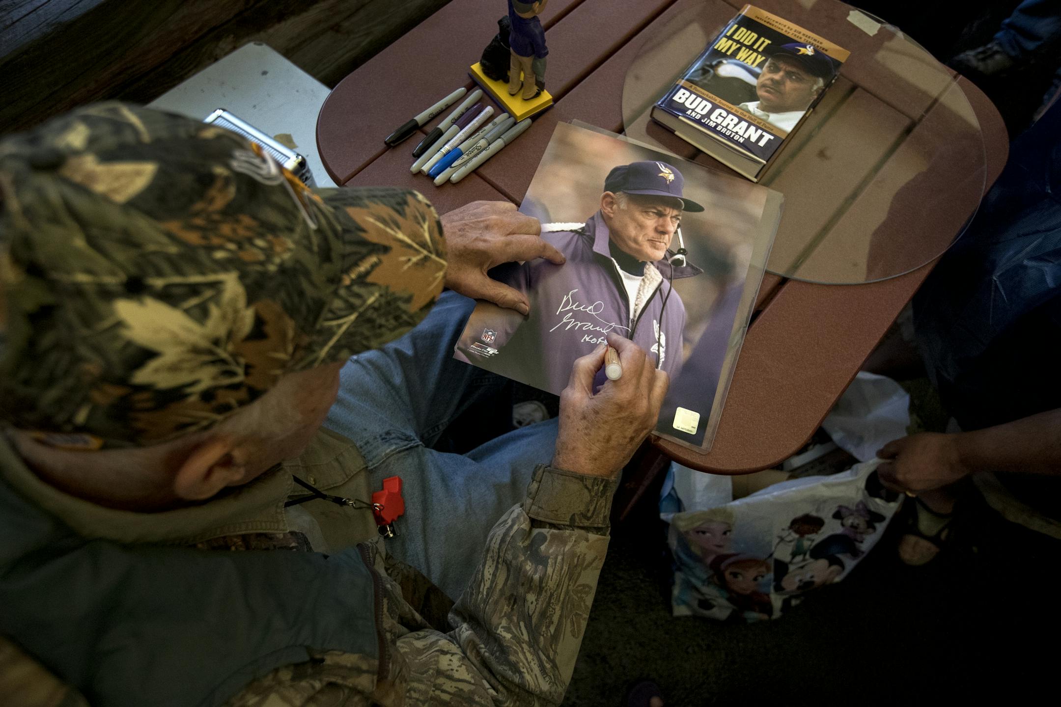 Bud Grant signed a photo during his annual garage sale. The former Minnesota Vikings head coach turns 90 years old on May 20.