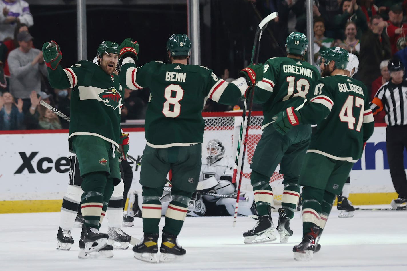 Minnesota Wild left wing Marcus Foligno, left, looks to teammate defenseman Jordie Benn (8) in celebration after Foligno scored a goal during the second period of an NHL hockey game against the Los Angeles Kings, Sunday, April 10, 2022, in St. Paul, Minn. (AP Photo/Stacy Bengs)