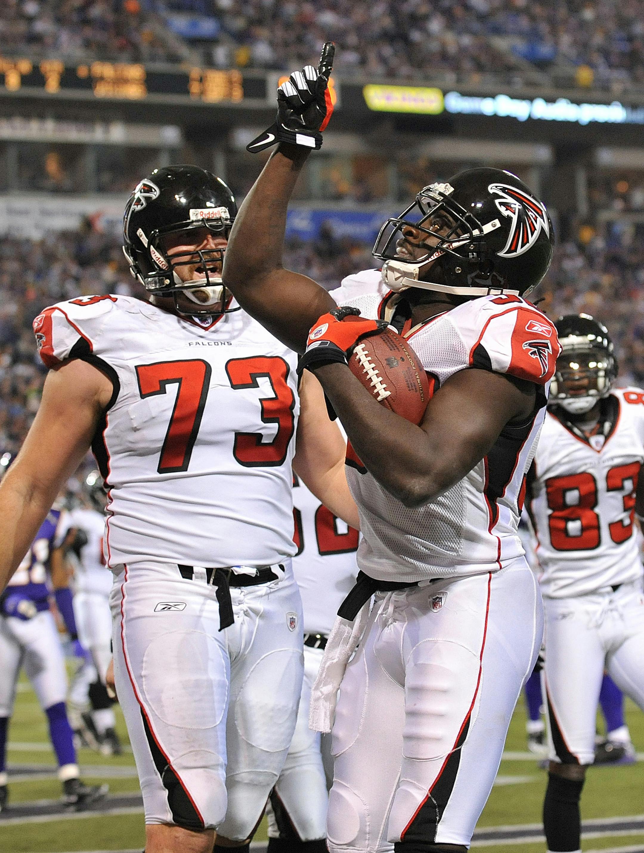 MINNEAPOLIS - DECEMBER 21: Jerious Norwood #32 of the Atlanta Falcons celebrates a first half touchdown during an NFL game against the Minnesota Vikings at the Hubert H. Humphrey Metrodome, on December 21, 2008 in Minneapolis, Minnesota.