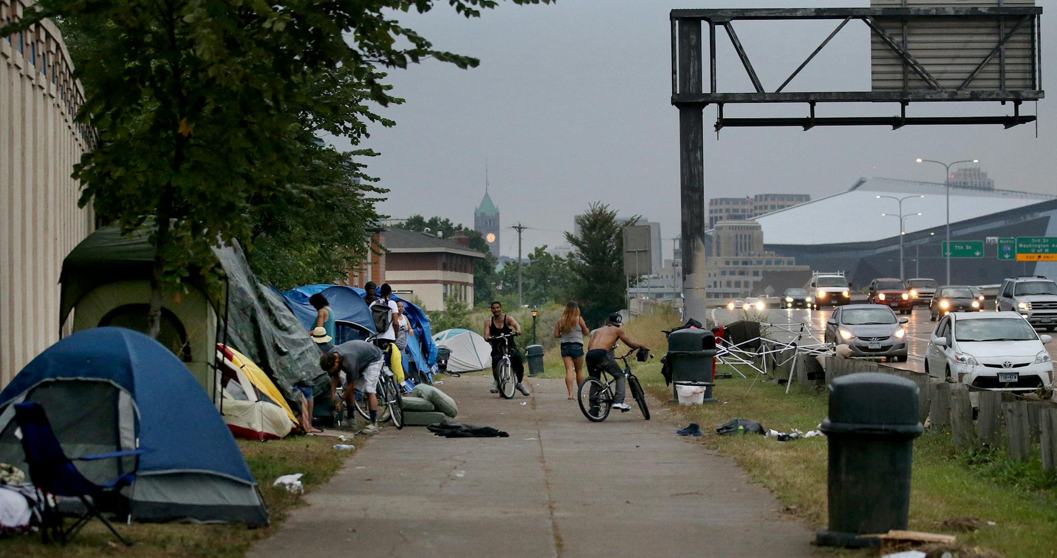 An American Indian encampment in south Minneapolis continues to grow and now includes several families with children. Some have come hoping to receive services that might end their homelessness. Here, the skies darken as a rain storm approaches Monday, Aug. 27, 2018, in Minneapolis, MN.] DAVID JOLES ï david.joles@startribune.com Homeless families at the American Indian encampment in south Minneapolis**Koda Deer,cq