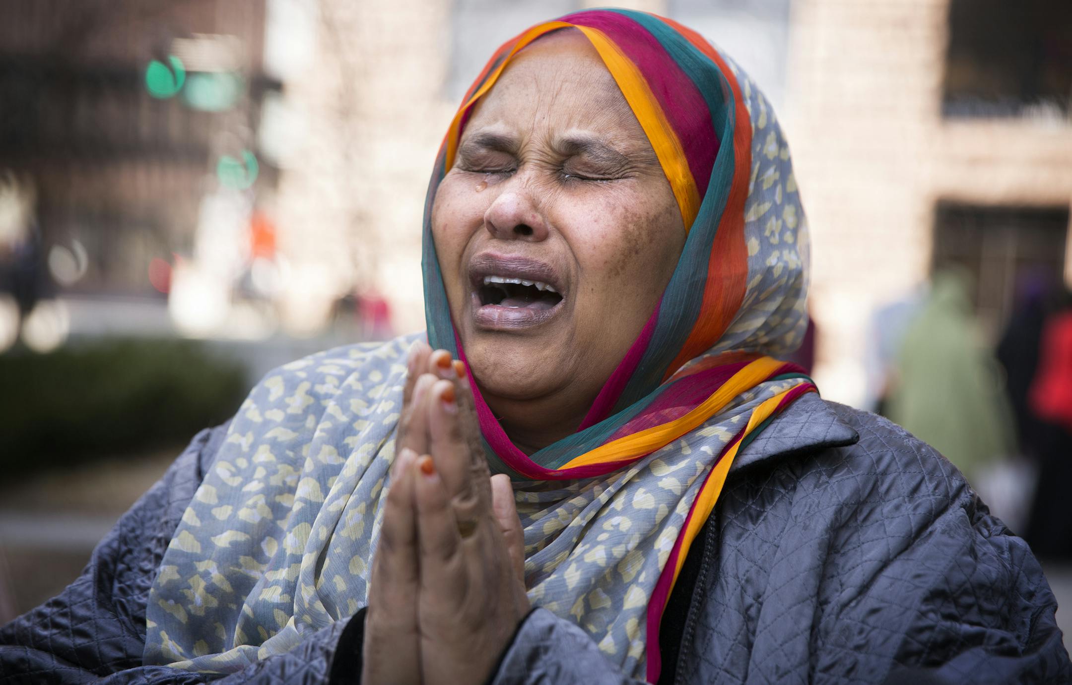 Halima Yusuf, a friend of terror suspect Hanad Mustafe Musse&#x2019;s family, wept for the young men outside the U.S. Courthouse in St. Paul.