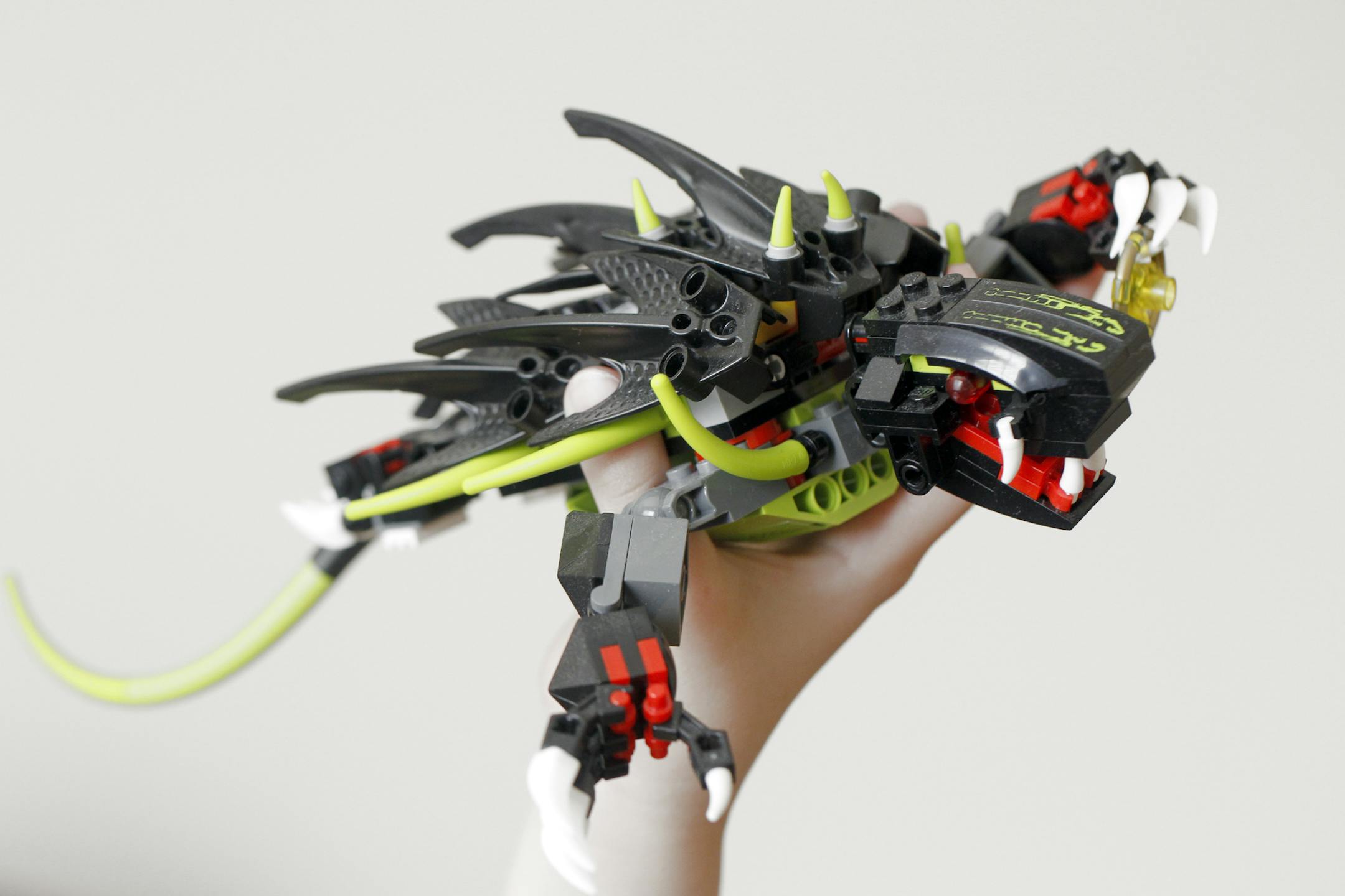 TOM WALLACE ¥ twallace@startribune.com Assignments #20017866A_ May 11, 2011_ SLUG: legofest05xx_ Caroline and Will Lambert have 2 boys, Reid, 9, Henry, 7, and a daughter, Ella, 5 - all play with the plastic building parts legos _ IN THIS PHOTO:] Ella holds a finished lego character.