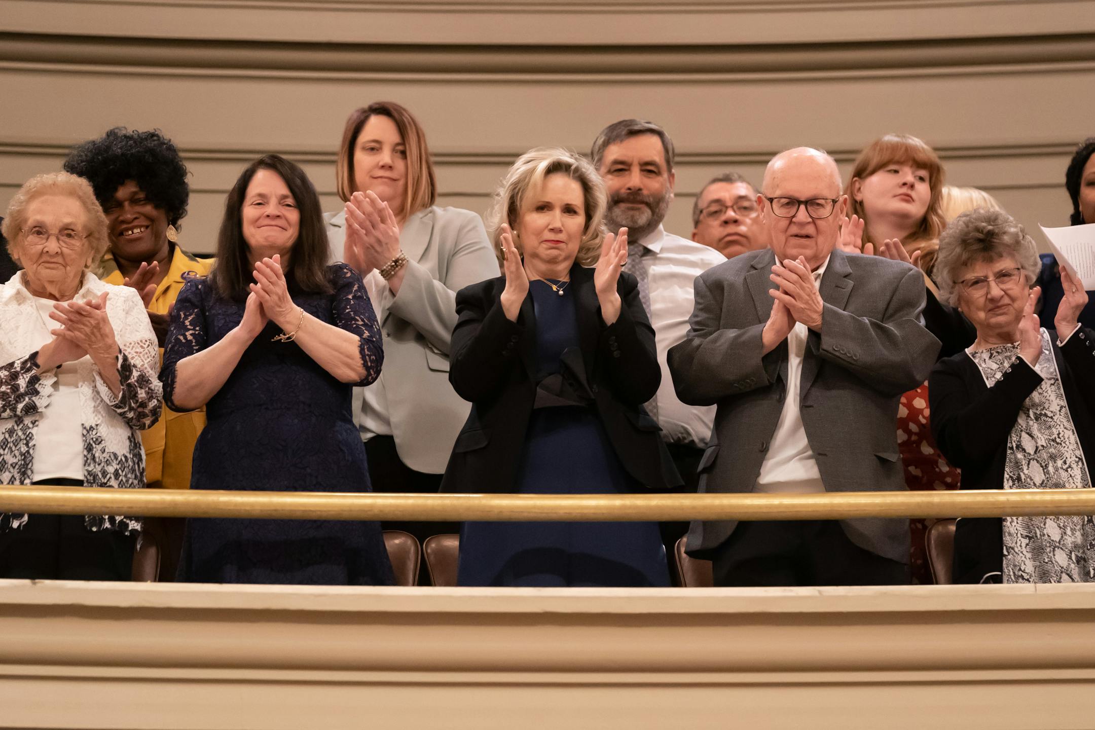 First Lady Gwen Walz applauded as her husband Gov Tim Walz entered the House Chamber.