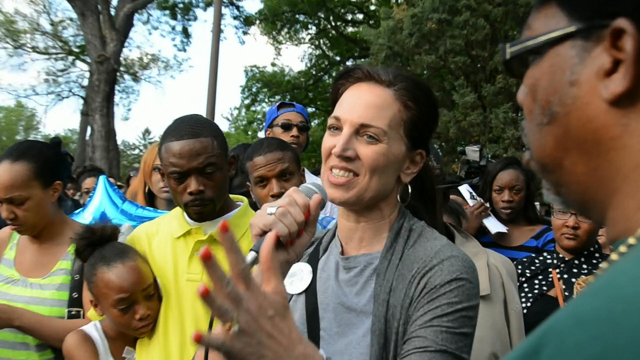 Carla Steinbach, principal of Edison High School, where Nehemiah went to school, spoke to the crowd gathered for a community vigil for the 17 year old who was fatally shot June 1st. She described him as "an amazing young man". ] DAVID BREWSTER/STAR TRIBUNE