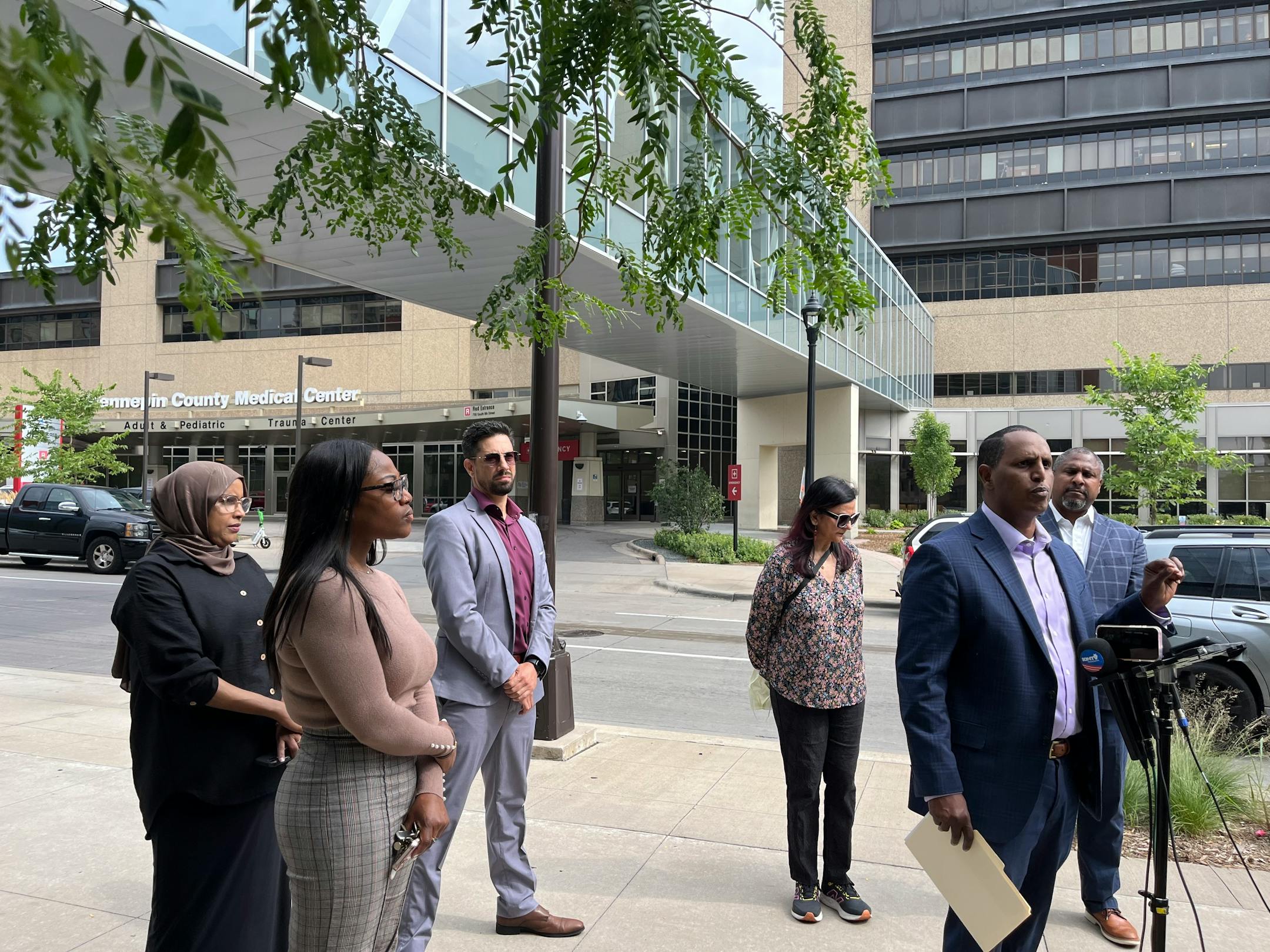 Hennepin Healthcare System's Board Chair Mohamed Omar stands with members of the board outside HCMC. The board might be dissolved if a Hennepin County Board resolution passes to give the commissioners a more active role over the hospital.