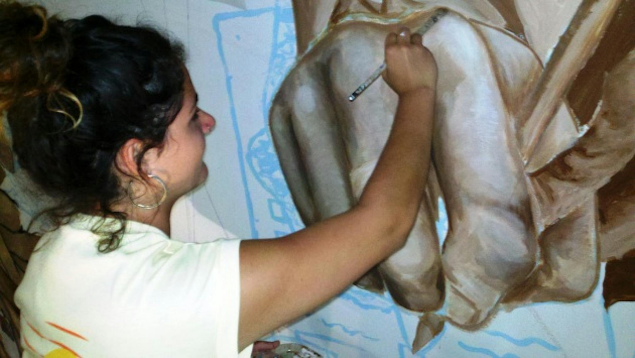 Junior Samie Johnson works on South's new mural