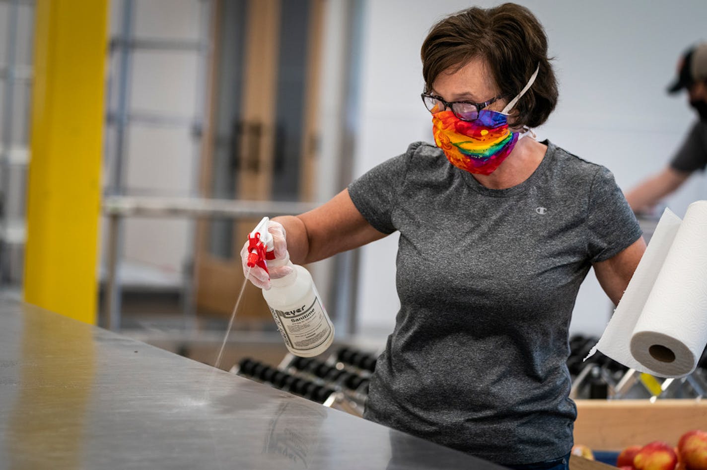 Volunteer Sheila Dingels of Minneapolis sanitized after her volunteer shift at Second Harvest Heartland in Brooklyn Park.