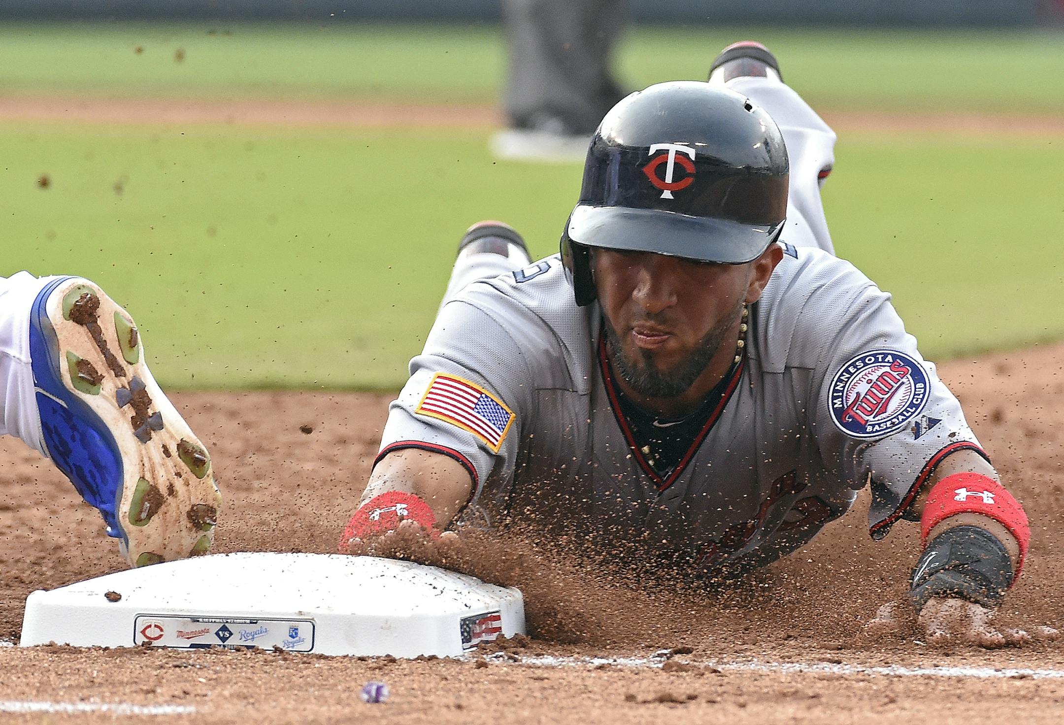 The Minnesota Twins' Eddie Rosario is doubled up by Kansas City Royals first baseman Eric Hosmer on a line drive by designated hitter Miguel Sano to end the top of the third inning on Saturday, July 4, 2015, at Kauffman Stadium in Kansas City, Mo. (John Sleezer/Kansas City Star/TNS)