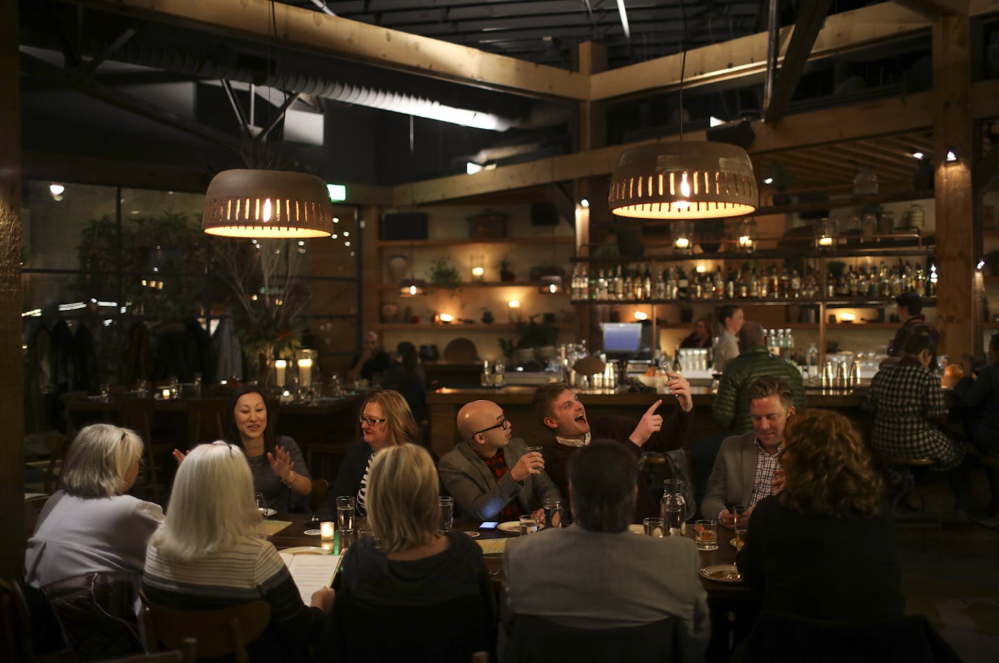 Diners at a long table in the center of the dining room of Young Joni. ] JEFF WHEELER &#x2022; jeff.wheeler@startribune.com Young Joni is the Star Tribune's Restaurant of the Year for 2017. The Northeast Minneapolis restaurant was photographed Thursday evening, December 7, 2017.