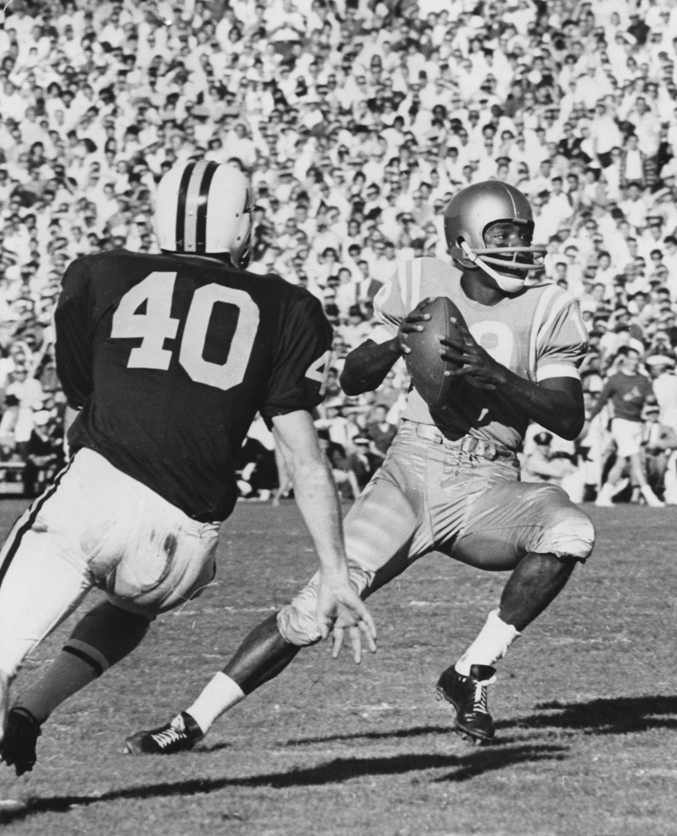 University of Minnesota Gophers football, Rose Bowl game, against UCLA, New Years Day 1962. The Gophers' Dave Mulholland (#40) stops Bob Smith of UCLA. File photo ran January 2, 1962, in the Minneapolis STAR, and on the Star Tribune editorial page Mon Dec 24, 2001, page A12.