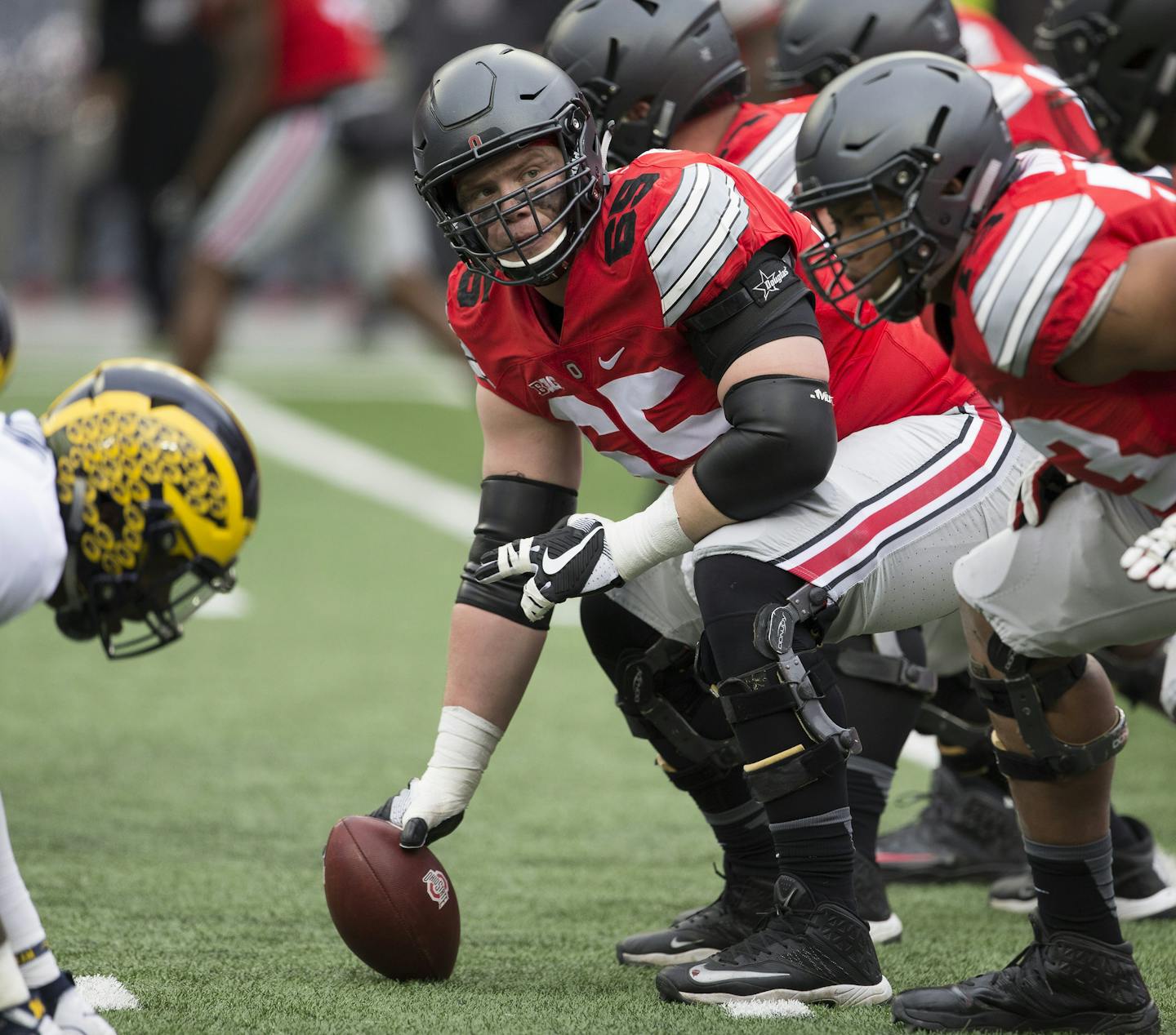 COLUMBUS, OH - NOVEMBER 26: Offensive lineman Pat Elflein (65) of the Ohio State Buckeyes makes sure the line is ready during an NCAA football game between the Michigan Wolverines and the Ohio State Buckeyes on November 26, 2016, at Ohio Stadium in Columbus, OH. (Photo by Khris Hale/Icon Sportswire) (Icon Sportswire via AP Images) ORG XMIT: 265436