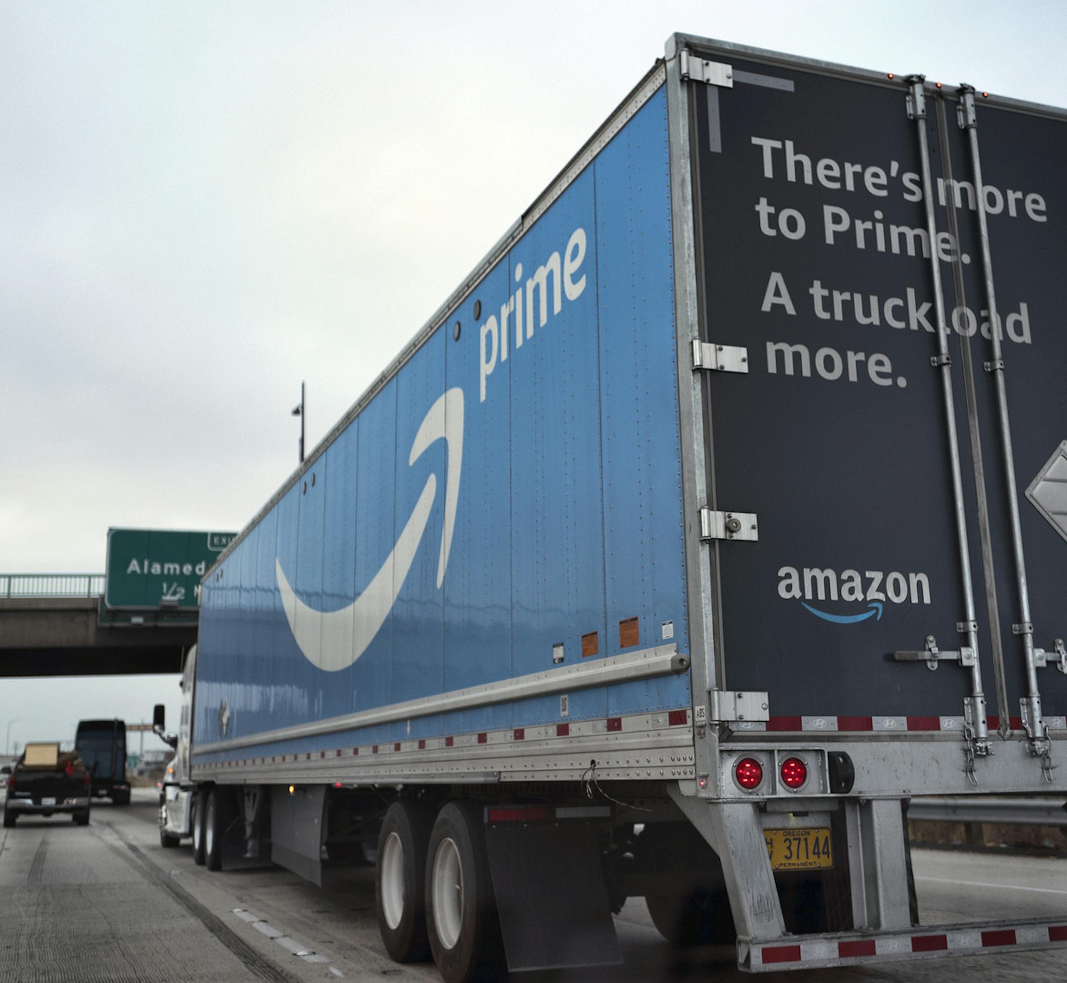 An Amazon truck makes its way along Interstate 5, towards downtown Los Angeles on Friday, June 28, 2019. (AP Photo/Richard Vogel)