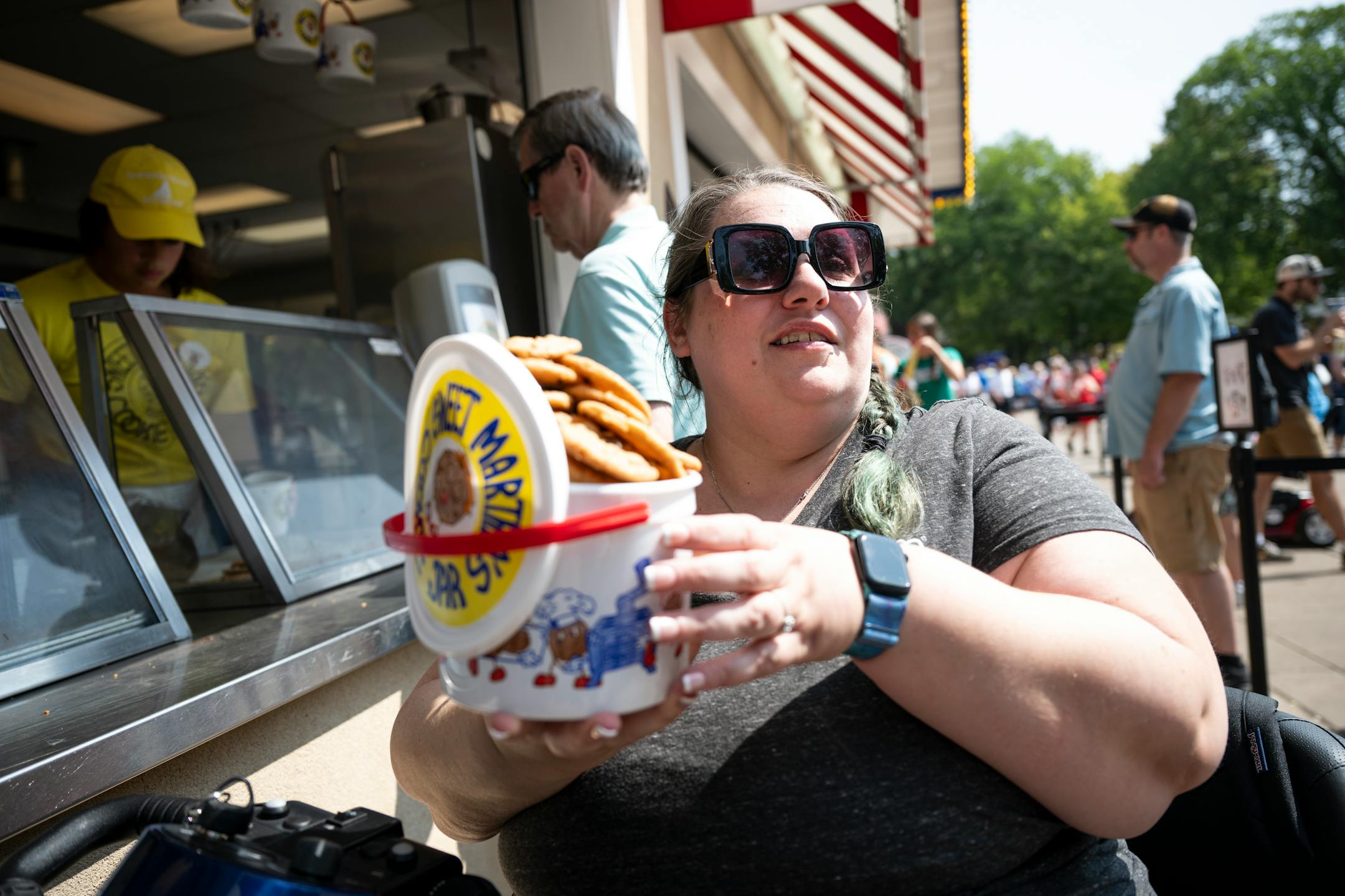Jillian Nelson, a disability advocate with the Autism Society of Minnesota (AUSM), purchased a bucket of Sweet Martha's Cookies.