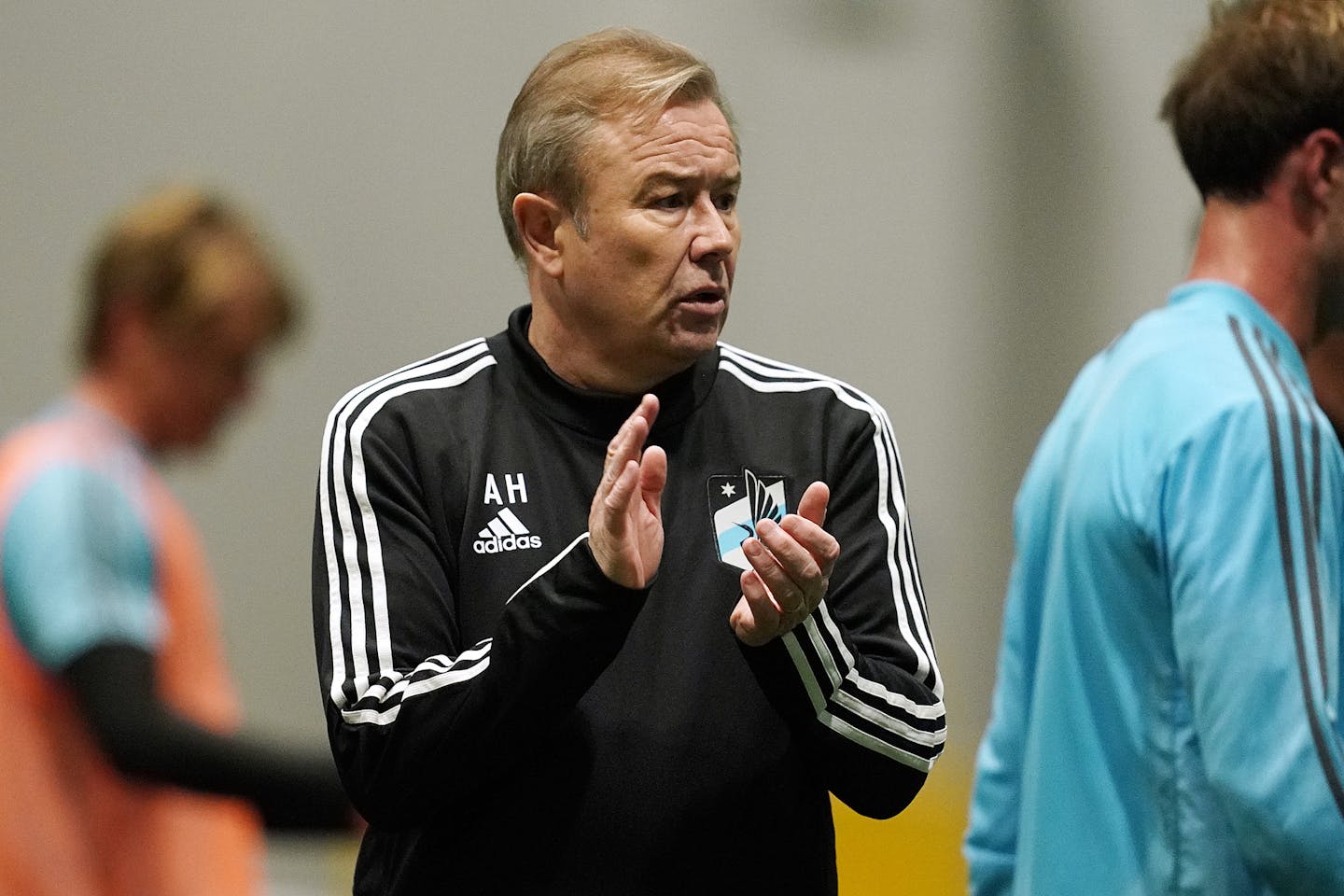 Minnesota United coach Adrian Heath applauded his players after practice on Jan. 22 at their practice facility in Blaine.