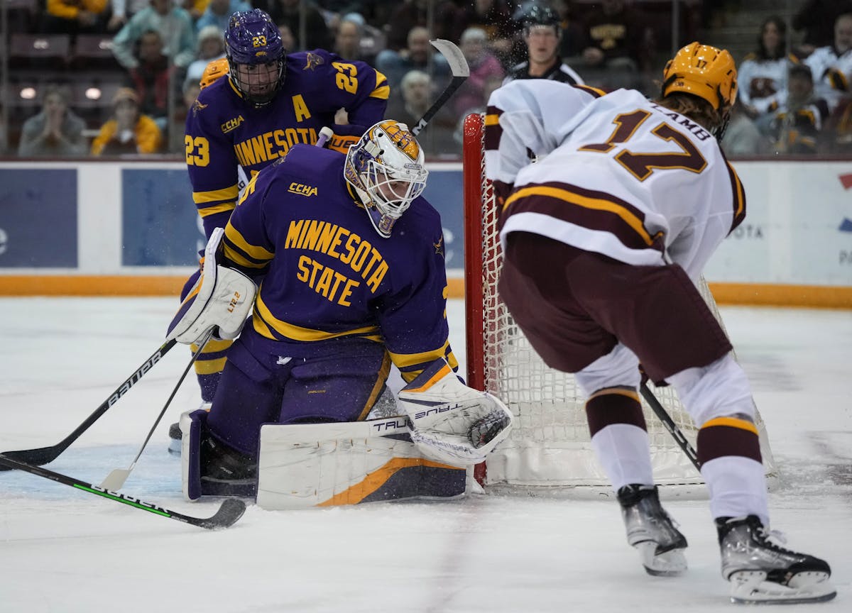 Minnesota State goaltender Keenan Rancier stops a shot by Gophers forward Brody Lamb in the first period.