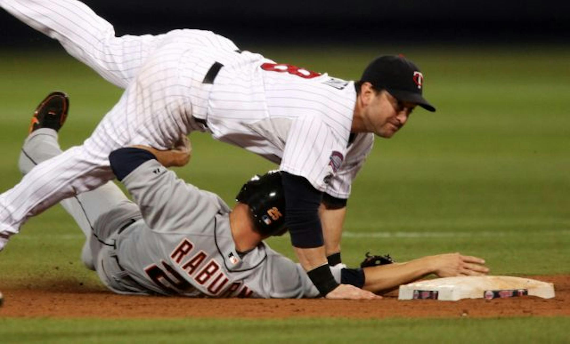 Twins second baseman Nick Punto made a key defensive play in the 12th inning, throwing home to force out Miguel Cabrera at the plate. The Twins went on to win 6-5 in the bottom of the 12th.