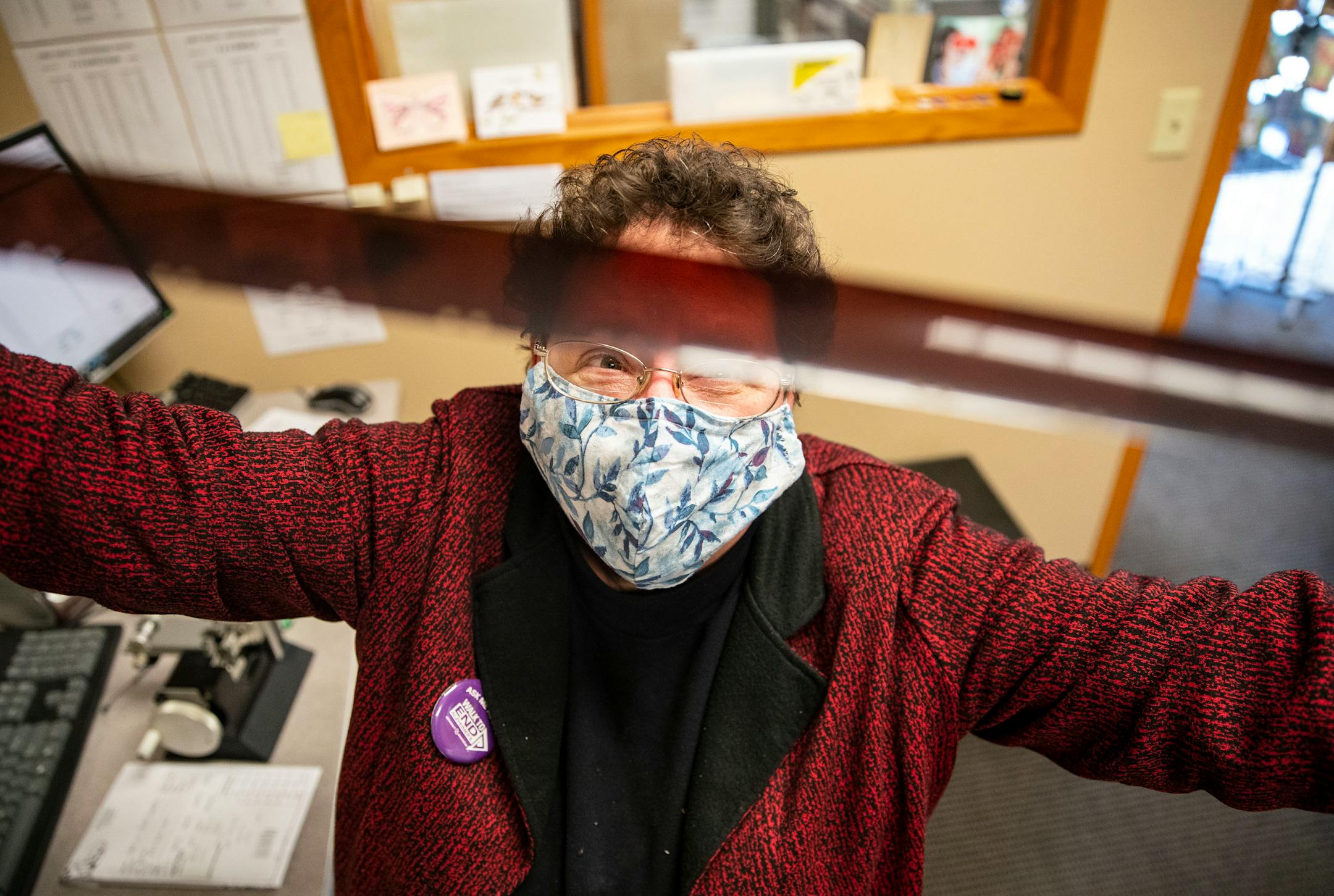 Cathy Mennes, co-owner of First Photo, examined one of the last rolls of 35mm film that the store would ever develop on Wednesday, March 31, 2021.