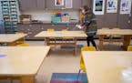 Sophie Gray Spehar disinfected each table in her art classroom at Piedmont Elementary School in Duluth in September.