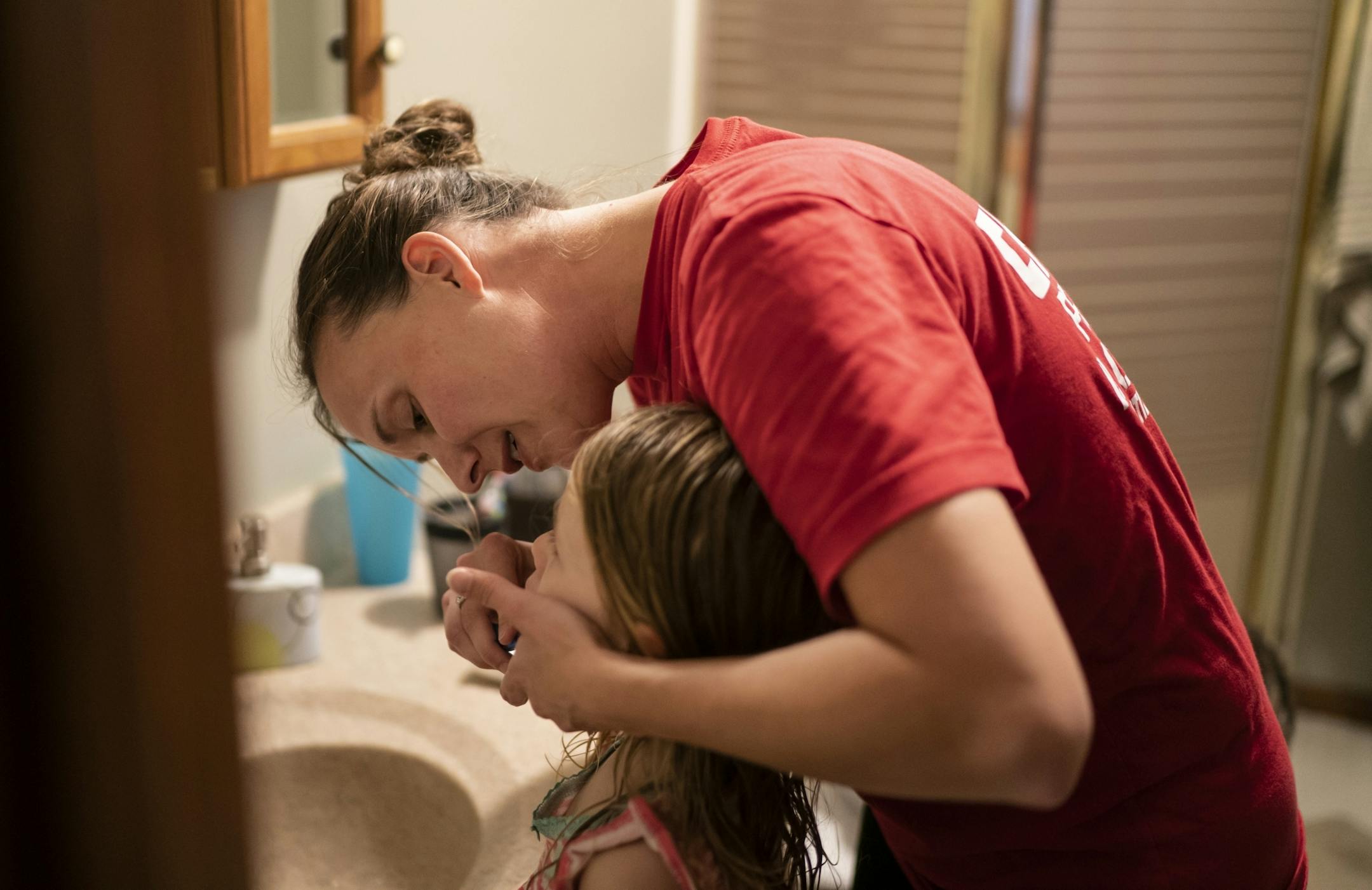 Jeanette Chafee brushed her daughter Ally's, 3, teeth before bed at home in Scandia, Minn., on Wednesday, September 18, 2019. Bedtime will be one of the biggest adjustments for her girls while she deploys since she puts them to bed most nights.