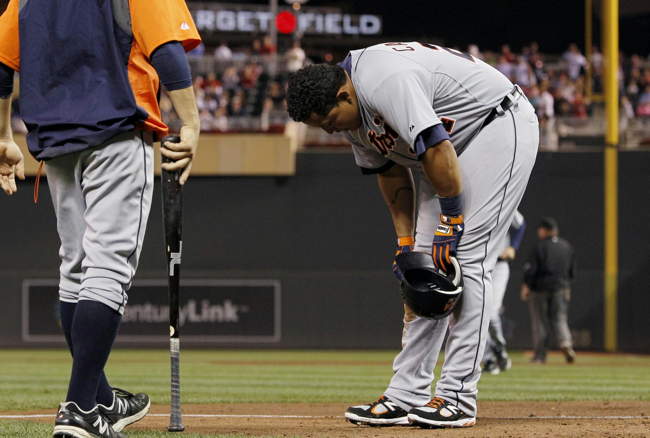 Detroit Tigers' Miguel Cabrera reacts after being tagged out at home plate by Minnesota Twins catcher Joe Mauer during the sixth inning of a baseball game, Friday, Sept. 28, 2012, in Minneapolis.