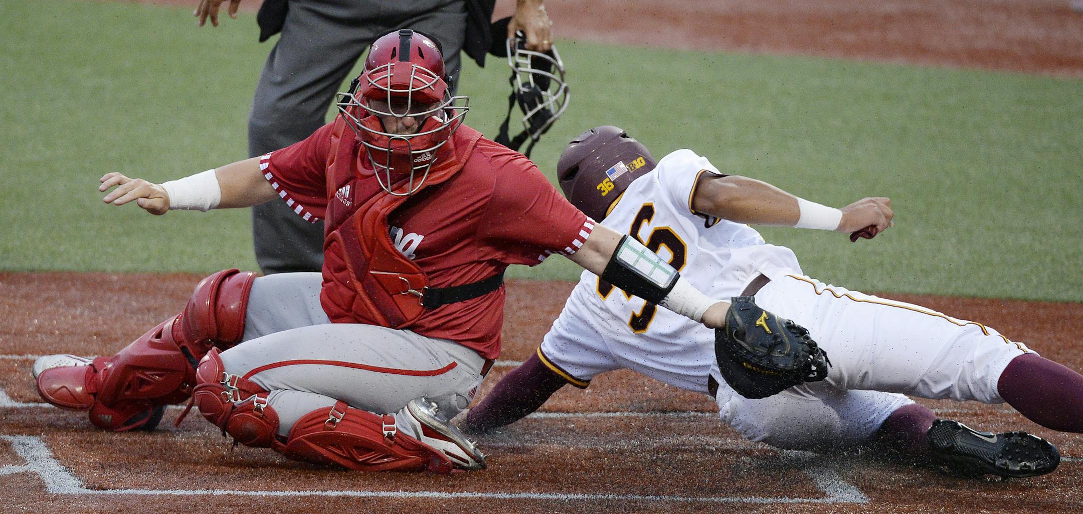Chris Howell | Herald-Times
Indiana catcher Ryan Fineman (29) could get the tag on Minnesota outfielder Jordan Smith (36) at home during the Indiana Minnesota Big Ten Baseball Tournament at Bart Kaufman Field in Bloomington, Ind. Friday, May 26, 2017. ORG XMIT: inbht101