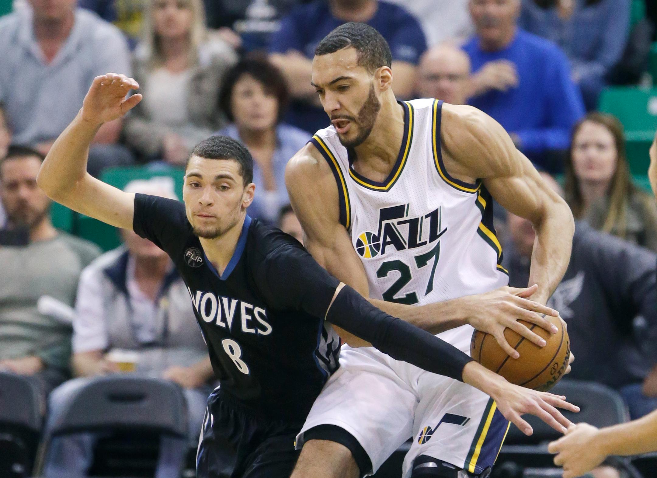 Minnesota Timberwolves guard Zach LaVine (8) attempts to steal the ball from Utah Jazz center Rudy Gobert (27) during the first quarter of an NBA basketball game Friday, April 1, 2016, in Salt Lake City. (AP Photo/Rick Bowmer)
