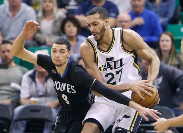 Minnesota Timberwolves guard Zach LaVine (8) attempts to steal the ball from Utah Jazz center Rudy Gobert (27) during the first quarter of an NBA bask