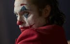 This image released by Warner Bros. Pictures shows Joaquin Phoenix in a scene from "Joker," in theaters on Oct. 4. Alarmed by violence depicted in a t