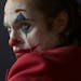 This image released by Warner Bros. Pictures shows Joaquin Phoenix in a scene from "Joker," in theaters on Oct. 4. Alarmed by violence depicted in a t