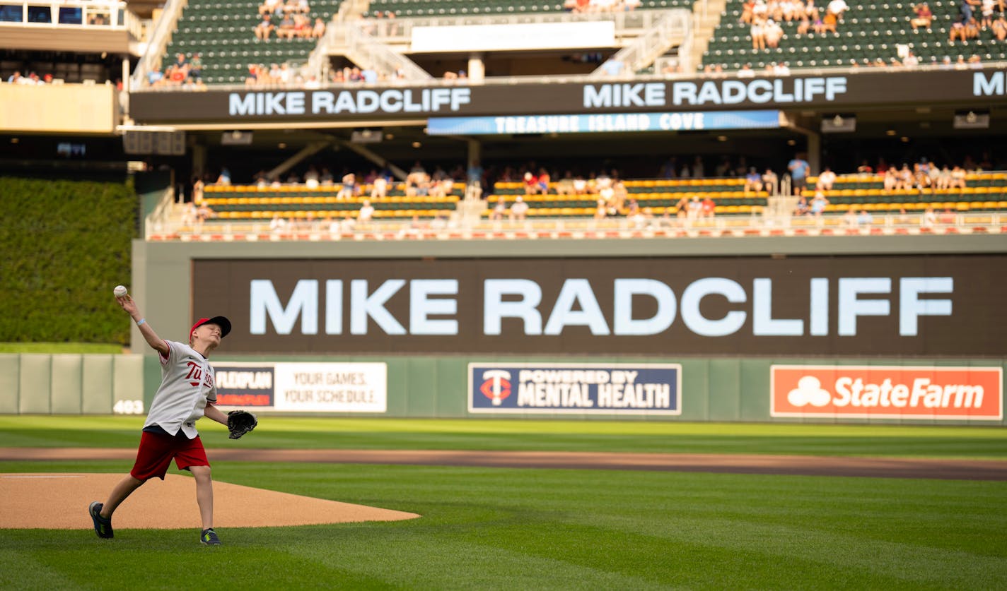 In a pregame ceremony, the Twins honored the late Mike Radcliff, a beloved member of Minnesota's front office staff. His grandson, Reece Kuchenrither, 10, threw out the ceremonial first pitch with Twins manager Rocco Baldelli catching. The Minnesota Twins faced the Kansas City Royals in an MLB baseball game Monday night, July 3, 2023 at Target Field in Minneapolis. ] JEFF WHEELER • jeff.wheeler@startribune.com