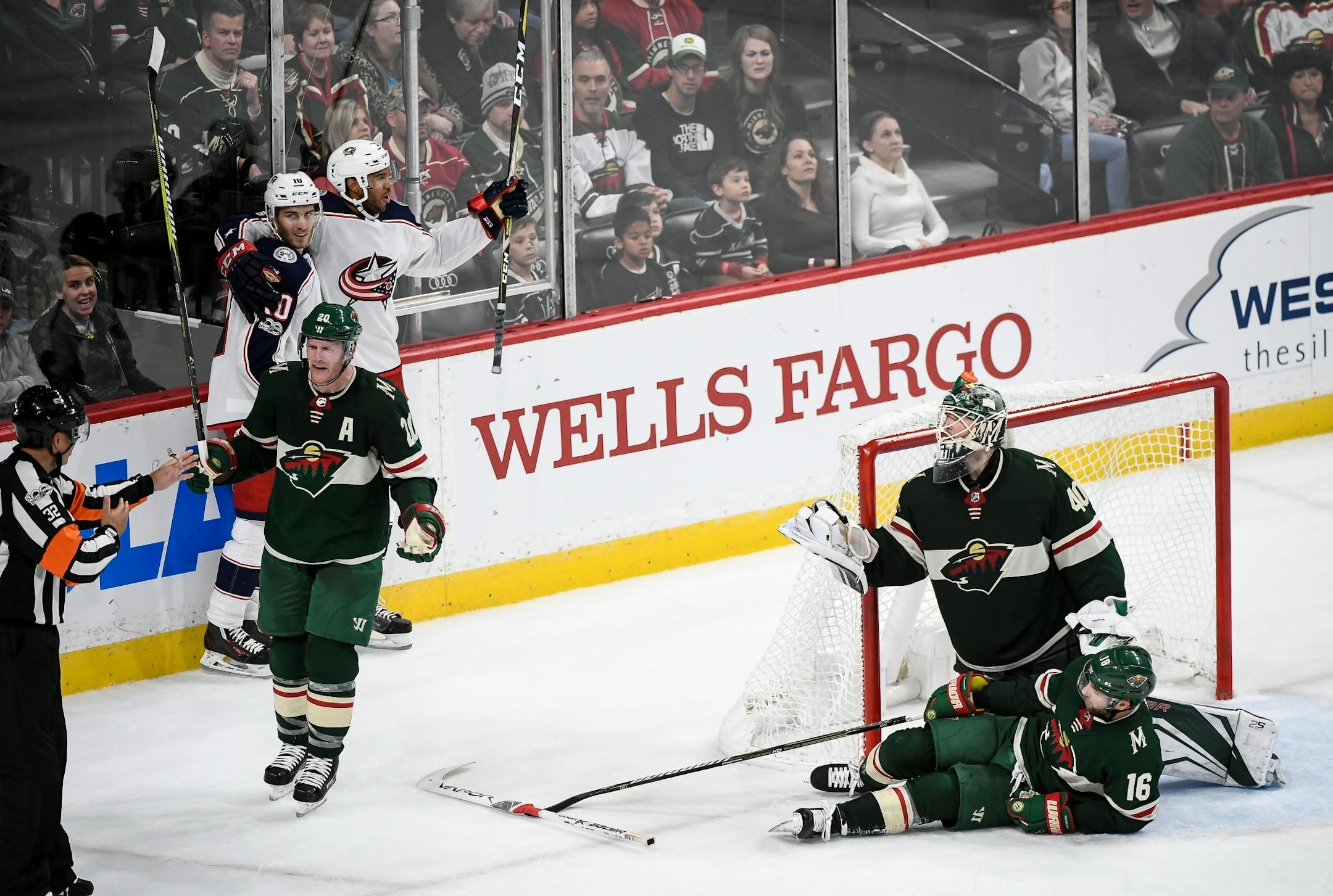 Minnesota Wild defenseman Ryan Suter (20) argued with referee Tom Kowal (32) after the game-winning goal was scored in overtime by Columbus Blue Jackets center Alexander Wennberg (10).