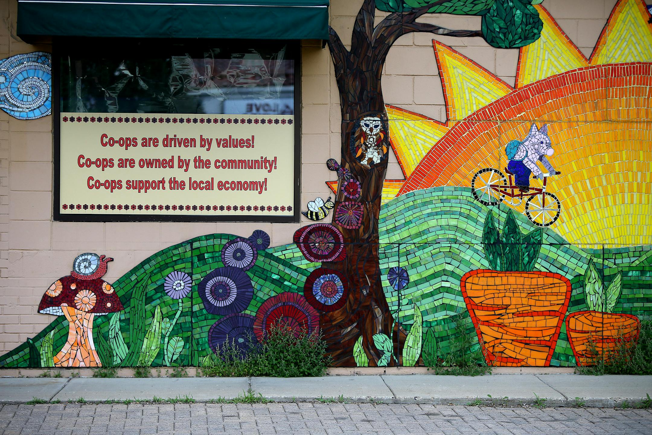 Amy Fields the general manager of the Eastside Food Coop on Central Avenue N.E., said the Coop is raising money to pave the way for an expansion, Monday, June 9, 2014 in Minneapolis, MN. They purchased the "Love Lines," building next to the coop with plans to demolish the building as part of the renovation plans. ] (ELIZABETH FLORES/STAR TRIBUNE) ELIZABETH FLORES • eflores@startribune.com