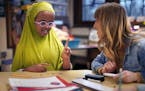 Fifth-grader Khadra worked with Kyrstin Tenjack, a special education assistant, at Howe School in Minneapolis.