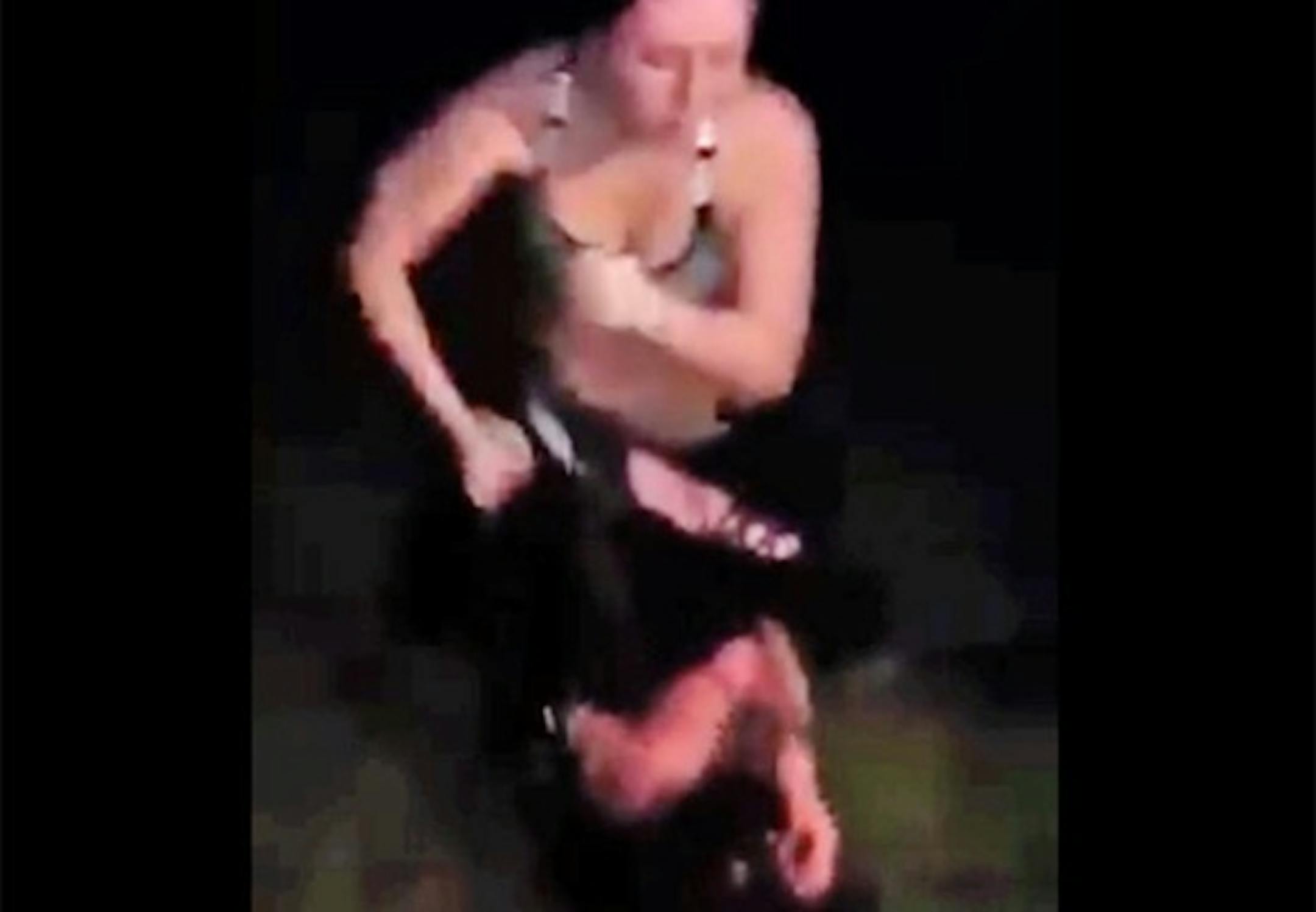 This image from a video shows Cassandra Borden beating her 15-year-old victim.