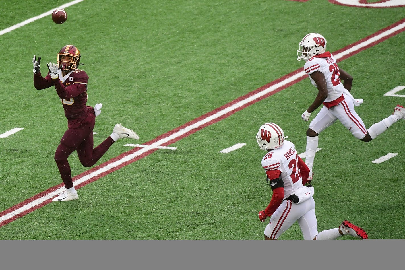 Gophers wide receiver Rashod Bateman scored a touchdown with Wisconsin's Eric Burrell (25) and Semar Melvin (20) in pursuit