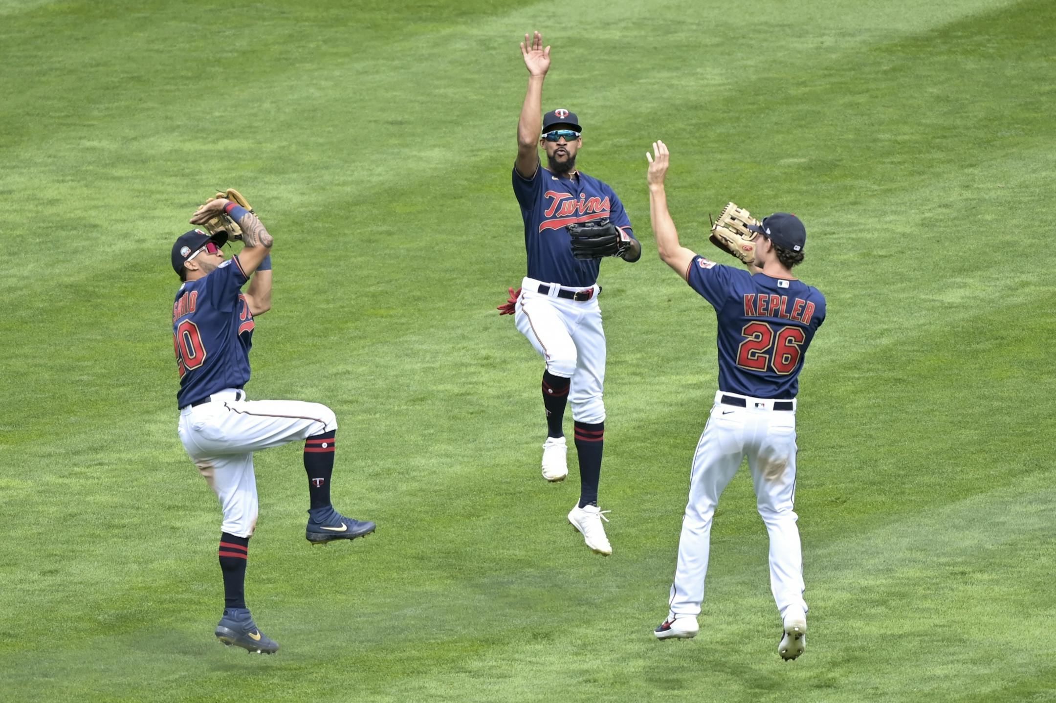 Minnesota Twins left fielder Eddie Rosario (20), center fielder Byron Buxton (25) and right fielder Max Kepler (26) celebrated their 4-2 victory against the Kansas City Royals.