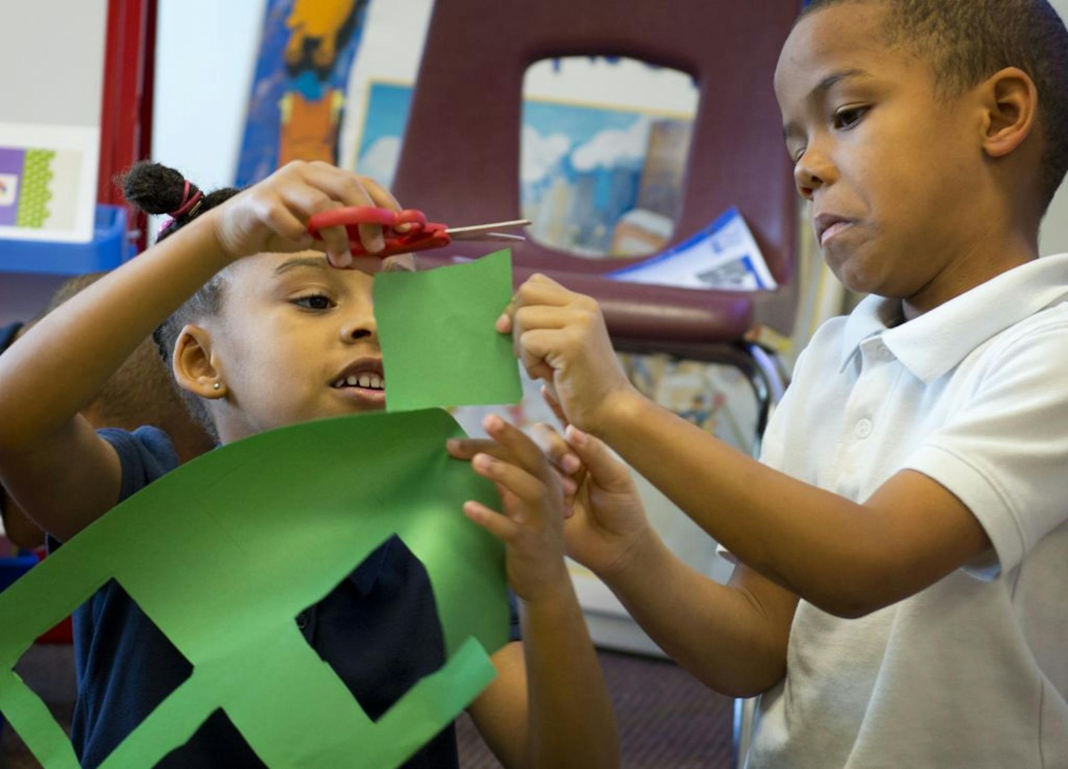 Maxfield Magnet School kindergartners Jalena Campbell and Steven Lindsay prepared to learn about shapes.