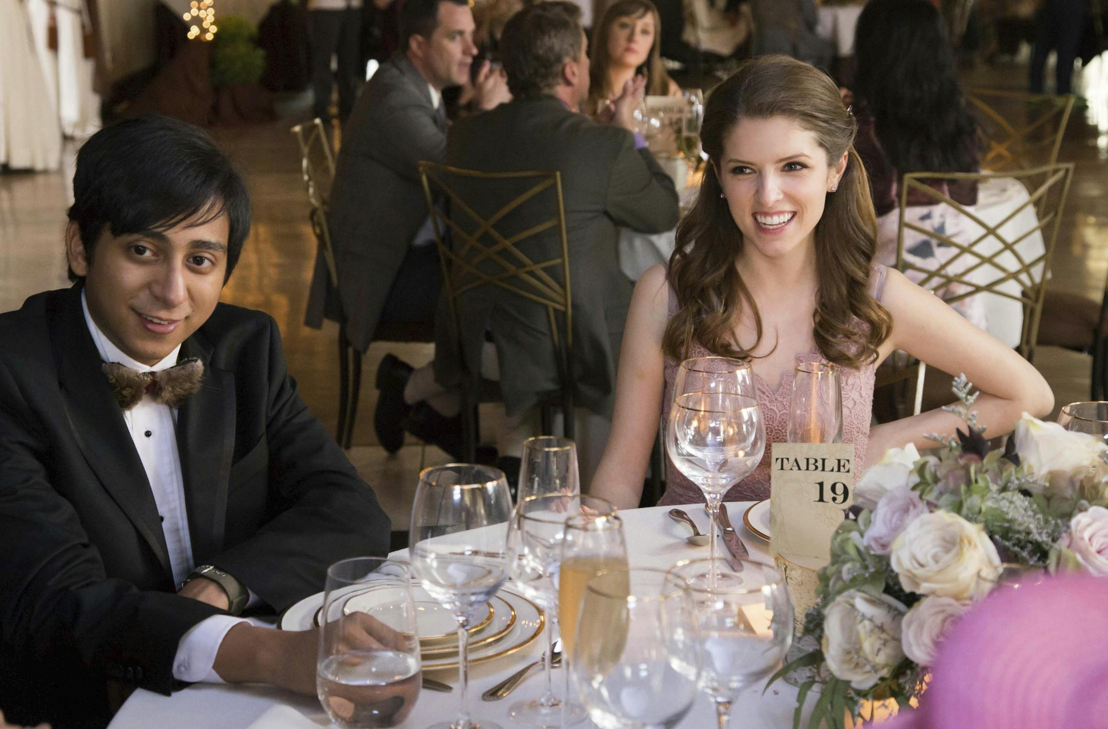 This image released by Fox Searchlight Pictures shows Tony Revolori, left, and Anna Kendrick in a scene from "Table 19." ( Jace Downs/Fox Searchlight Pictures via AP)