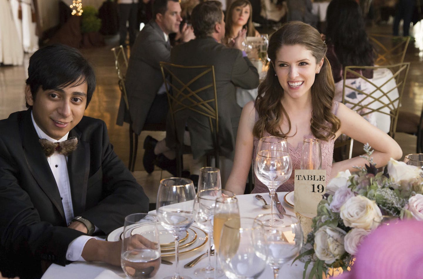 This image released by Fox Searchlight Pictures shows Tony Revolori, left, and Anna Kendrick in a scene from "Table 19." ( Jace Downs/Fox Searchlight Pictures via AP)