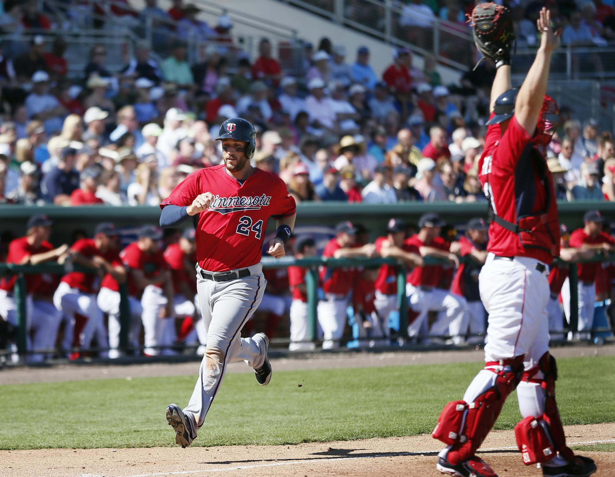 Twins third baseman Trevor Plouffe scored in the forth inning on a hit by Oswaldo Aricia . The Boston Red Sox hosted the Minnesota Twins in the both team's fist spring training game Friday Feb 28. 2014 in Fort Myers, Florida at Jet Blue Park .Twins beat Boston 8-2. ] JERRY HOLT jerry.holt@startribune.com Jerry Holt