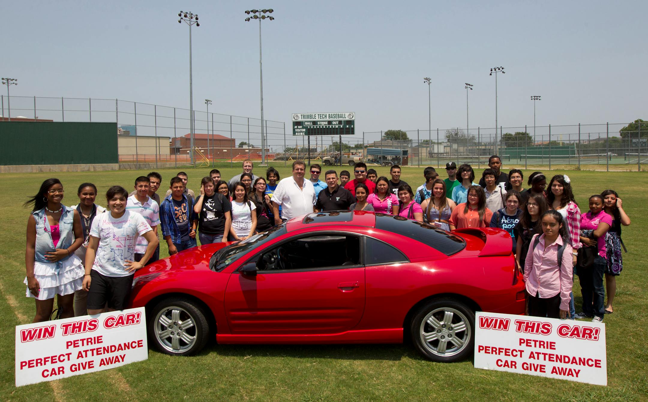 Twenty six students had perfect attendance this year and they gathered with teachers, principal, and owner of Petrie Auto Sales hoping to win a car, May 2,5 2012, in Fort Worth, Texas. Petrie Auto Sales gave away a 2002 Mitsubishi Eclipse to one of the top ten perfect attendance students at Trimble Tech High School. (Joyce Marshall/Fort Worth Star-Telegram/MCT)