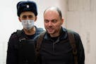 FILE - Russian opposition activist Vladimir Kara-Murza is escorted to a hearing in a court in Moscow, Russia, Feb. 8, 2023. A court in Moscow on Monda