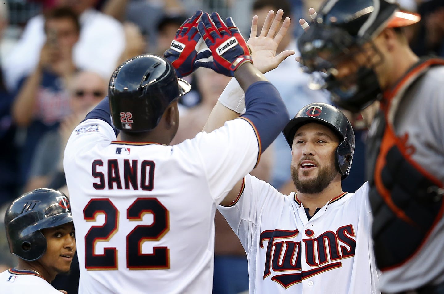 Miguel Sano (22) was greeted by Trevor Plouffe (24) after he hit the first home run of his career in the first inning. ] CARLOS GONZALEZ cgonzalez@startribune.com - July 7, 2015, Minneapolis, MN, Target Field, MLB, Minnesota Twins vs. Baltimore Orioles