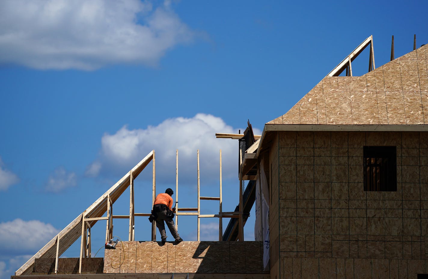 Crews worked on a home under construction in the Bailey Meadows development Friday in Newport. ] ANTHONY SOUFFLE • anthony.souffle@startribune.com Construction crews worked on several single family home developments Friday, July 31, 2020 in Newport, Minn.