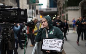 Sarah Louis protests outside Trump Tower on the morning after the presidential election, in Manhattan, Nov. 9, 2016. Trump&#x2019;s surprise victory e