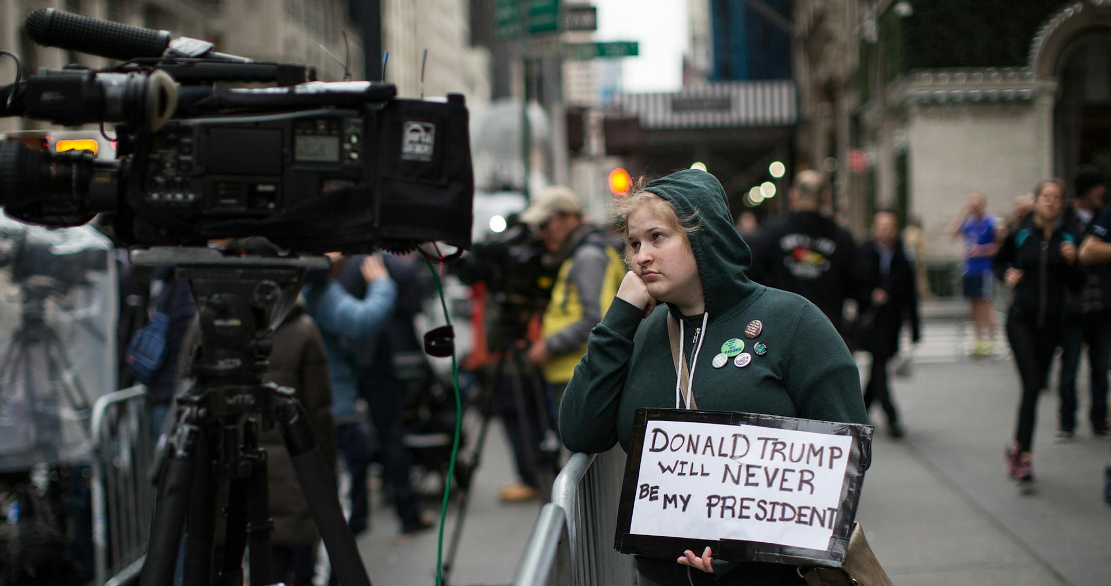 Sarah Louis protests outside Trump Tower on the morning after the presidential election, in Manhattan, Nov. 9, 2016. Trump’s surprise victory ended an erratic and grievance-filled campaign that took direct aim at his own party and long-held ideals of American democracy. (Christopher Lee/The New York Times) ORG XMIT: MIN2016111014094148