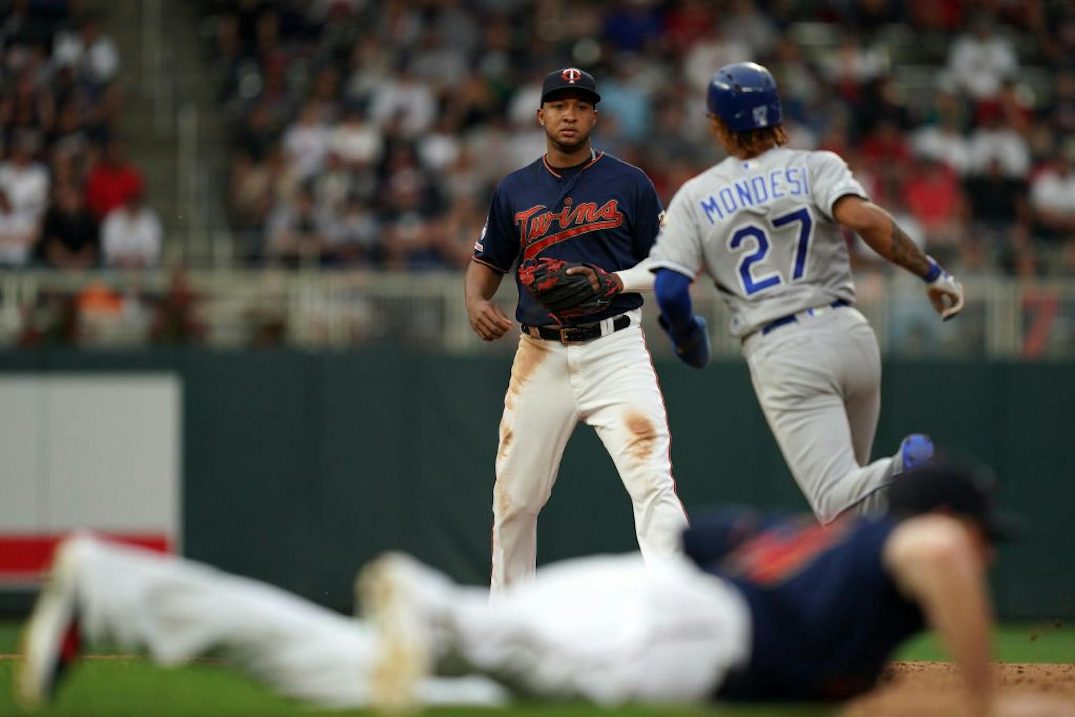 Minnesota Twins second baseman Jonathan Schoop (16) watched as Kansas City Royals second baseman Adalberto Mondesi (27) rounded second on a ball hit by Kansas City Royals right fielder Jorge Soler (12) in the fifth inning.