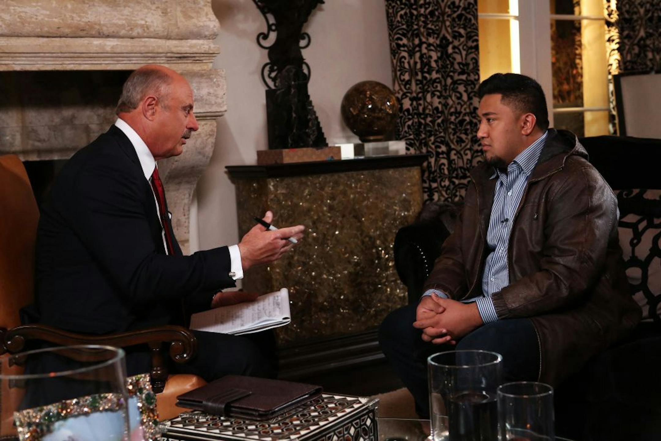 Dr. Phil McGraw, left, interviews Ronaiah Tuiasosopo